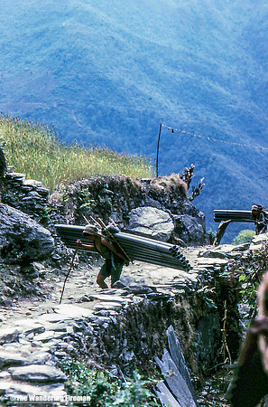 Carrying heavy loads on the trail in Nepal