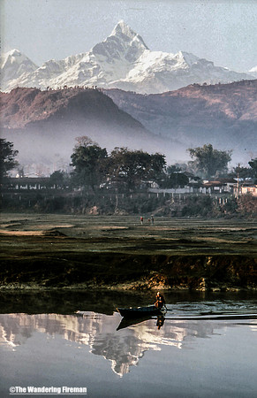 Man in a boat in Pohkra Nepal-2