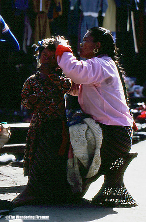 Mother tending child in Kathmandu Nepal-1