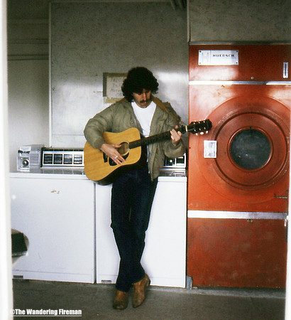 Bill Lazarou playing my guitar on our trip to California