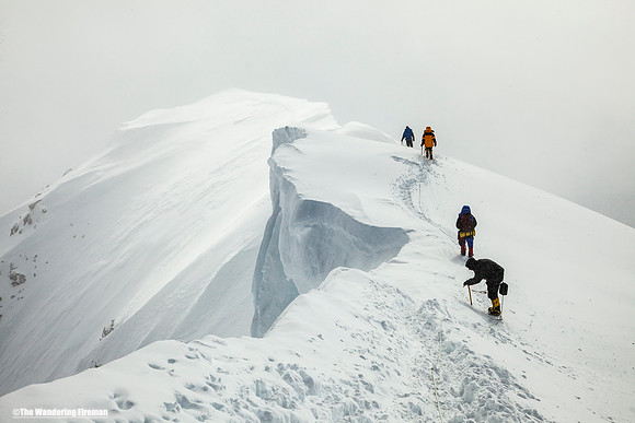 Descending along summit ridge of Denali, Alaska, the highest mountain in North America