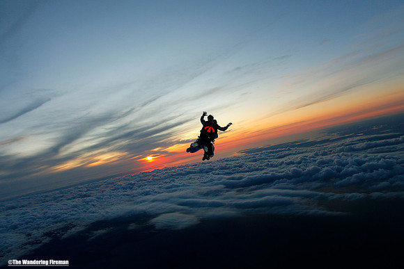 Tandem skydive with setting sun
