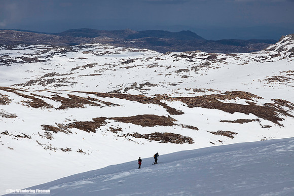 Two hikers approach the summit of Kosciuszko in Australia