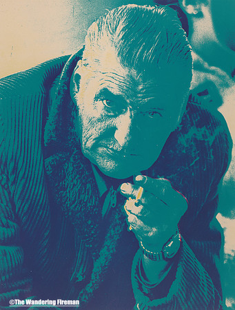 Early colour image of an old man smoking
