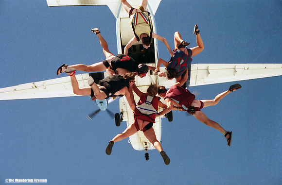 Nude skydivers making a jump out of a tailgate