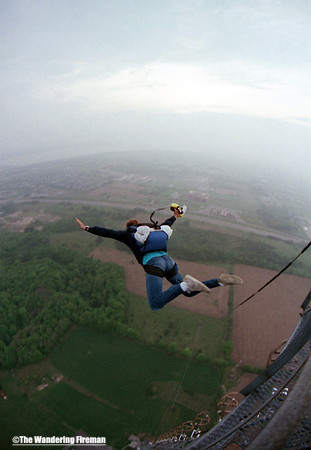 Bill Pollack skydiver making a base jump from an antenna