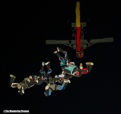 Tube skydive exit from a tailgate at dusk